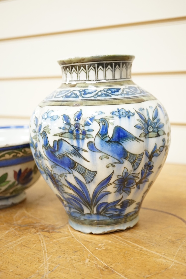 A Persian bird painted fritware lobed vase, 19.5cm high and a similar bowl, Qajar dynasty (2)